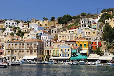 Overlooking the picturesque houses of the small island of Symi near Rhodes, Greece, Europe