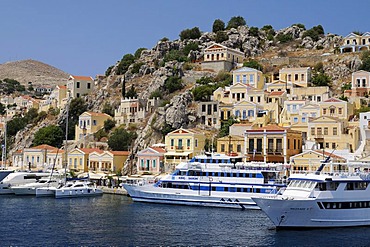 Dock with excursion boats at the center of the island of Symi near Rhodes, Greece, Europe