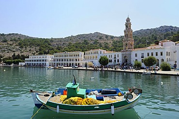 Fishing boat in front of the monastery Taxiarchis Michael Panormitis, Symi island near Rhodes, Greece, Europe