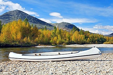 Canoe on the Atna river bank in Rondane National Park, Norway, Scandinavia, Europe