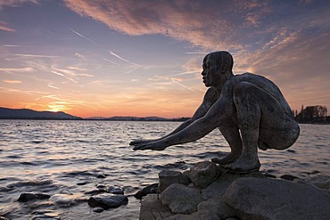 El Nino bronze sculpture at Radolfzell harbour at sunset, Radolfzell, Baden-Wuerttemberg, Germany, Europe