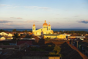 View from the tower of the church Iglesia de La Merced over the rooftops on the cathedral in front of the Lake Nicaragua, Granada, Nicaragua, Central America