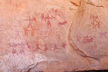 Painted people, neolithic rockart of the Acacus Mountains or Tadrart Acacus range, Tassili n'Ajjer National Park, Unesco World Heritage Site, Algeria, Sahara, North Africa