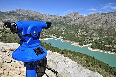 Telescope with a view on the storage lake of Guadalest, Costa Blanca, Spain, Europe