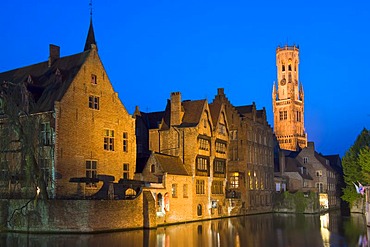 Illuminated Belfry and buildings along Rozenhoedkaai at dusk, historic centre of Bruges, Unesco World Heritage Site, Belgium, Europe