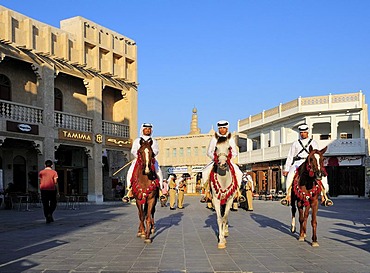 Mounted police in front of the tower of the Islamic Cultural Centre FANAR, Souk Waqif, Doha, Qatar, Middle East