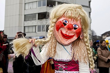 Individual dressed as a cheeky blond Bavarian Oktoberfest girl during the carnival procession, Littau, Lucerne, Switzerland, Europe