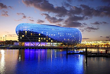 Yas Hotel on Yas Island, futuristic luxury hotel in the middle of the Formula 1 race track of Abu Dhab at dusk, United Arab Emirates, Middle East, Asia