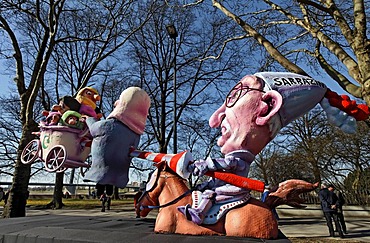 Thilo Sarrazin, impaling Turkish migrants, paper-mache figures, satirical themed parade float at the Rosenmontagszug Carnival Parade 2011, Duesseldorf, North Rhine-Westphalia, Germany, Europe