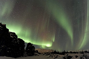 Northern Lights (Aurora borealis) over the canyons created by continental drift, ï¬ingvellir, Iceland, Europe