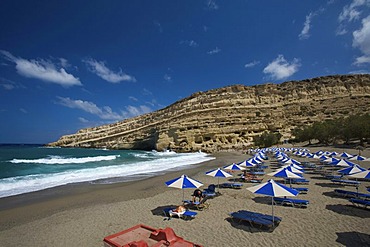 Chairs and parasols on the beach, Matala, Crete, Greece, Europe