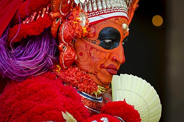 Performer wearing colourful make-up, Theyyam ceremony, near Kasargod, Kerala, Southern India, India, Asia