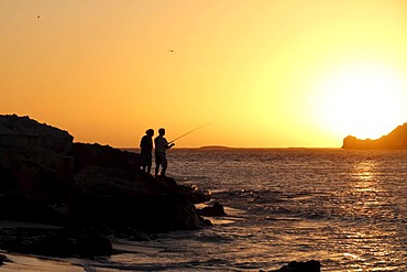 Fisherman enjoying a coastal sunset at Hamelin Bay, Western Australia