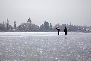 Frozen Lake Constance with people between Reichenau island and Hegne, Lake Constance, Baden-Wuerttemberg, Germany, Europe