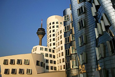 Rheinturm radio and tv tower and Gehry-Haus building, Medienhafen media harbour, Duesseldorf, North Rhine-Westphalia, Germany, Europe