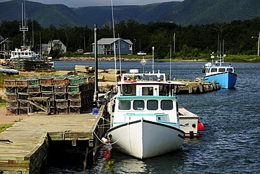 Fishing boats in the harbour, bay on the east coast of the Cape Breton National Park, Nova Scotia, Canada, North America