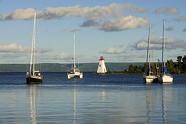 Bras d'Or Lake with lighthouse in the port of Baddeck, Nova Scotia, Canada, North America