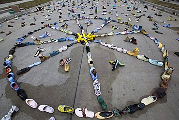 An art exhibit of thousands of shoes on the street by artist Tyree Guyton called "Street Folk" represents the issue of homelessness, part of Art X Detroit, a collection of performance art, music, and literary events held in Detroit, Michigan, USA, America