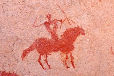 Painted rider on a horse, neolithic rockart of the Acacus Mountains or Tadrart Acacus range, Tassili n'Ajjer National Park, Unesco World Heritage Site, Algeria, Sahara, North Africa