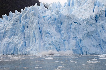 Ice falling off Garibaldi Glacier, Darwin National Park, Tierra del Fuego, Patagonia, Chile, South America