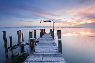 Evening mood at a wharf with ice on Lake Constance near Allensbach, Baden-Wuerttemberg, Germany, Europe