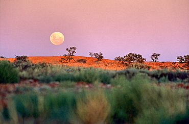 Full moon over Australian outback landscape, Coober Pedy, South Australia