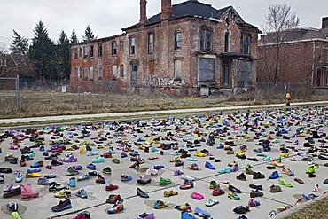 An art exhibit of thousands of shoes on the street by artist Tyree Guyton called "Street Folk" represents the issue of homelessness, part of Art X Detroit, a collection of performance art, music, and literary events held in Detroit, Michigan, USA, America