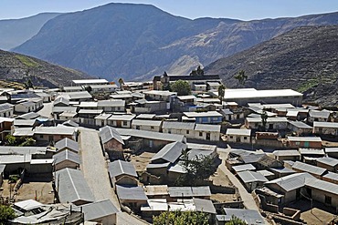 Overview, corrugated iron roofs, houses, mountains, Socoroma village, Putre, Altiplano, Norte Grande, northern Chile, Chile, South America