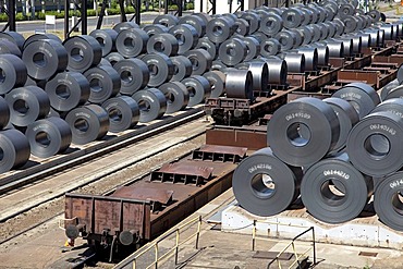 Finished flat steel rolls waiting for shipment by freight train, steelworks of ArcelorMittal, Eisenhuettenstadt, Brandenburg, Germany, Europe