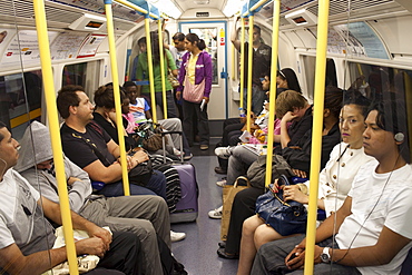 Passengers on an underground train, London, England, United Kingdom, Europe