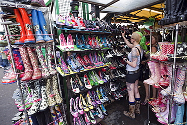 Customer in shoe shop, Camden High Street, Camden, London, England, United Kingdom, Europe