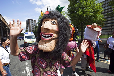 Masked participant in the Carnaval Del Pueblo Festival, Europes largest Latin Street Festival, Southwark, England, United Kingdom, Europe