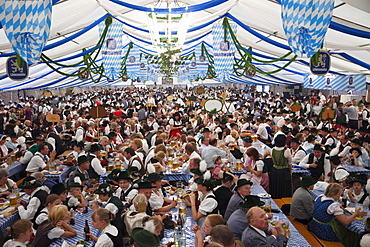 People in Bavarian costume inside beer tent, Oktoberfest, Munich, Bavaria, Germany