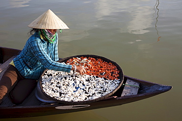 Boat woman and dried products, Hoi An, Vietnam, Indochina, Southeast Asia, Asia