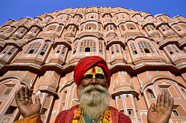 Sadhu outside the Palace of the Winds (Hawa Mahal), Jaipur, Rajasthan, India, Asia