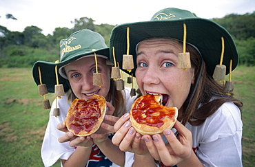 Girls eating a meat pies, Sydney, New South Wales, Australia, Pacific