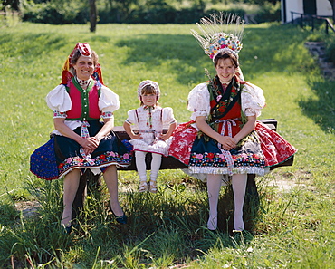 Women and little girl dressed in traditional folklore costume, Holloko, Hungary, Europe