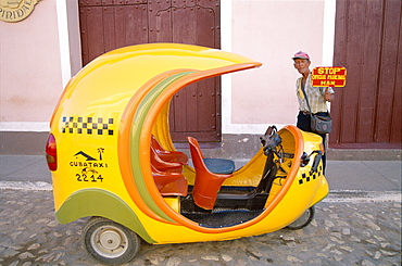 Cocotaxi and meter attendent, Trinidad, Cuba, West Indies, Central America