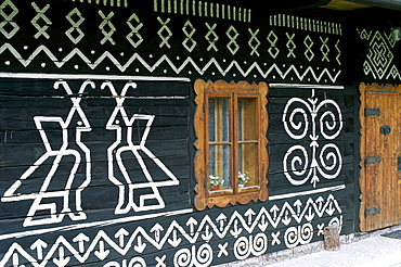 Decorative patterns on traditional painted house, Cicmany, The Mountain Regions, Slovakia, Europe