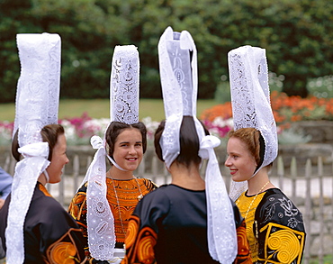 Women wearing lace headdresses (coiffes) and Breton traditional dress, Brittany, France, Europe