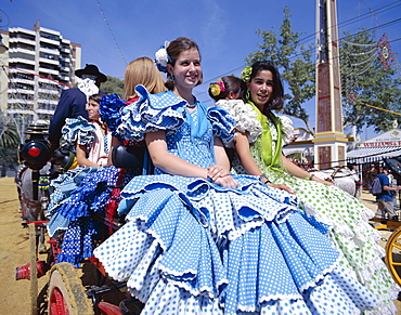 Girls dressed in Andalucian costume at the Horse Fair (Fiesta), Jerez de la Frontera, Andalusia, Spain, Europe