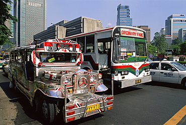 Typical traffic scene showing Jeepney, bus and taxi, Manila, Philippines, Southeast Asia, Asia