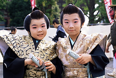 Two boys dressed in Samurai costume at Jidai Matsuri Festival held annually in November at Sensoji Temple Asakusa, Tokyo, Honshu, Japan, Asia