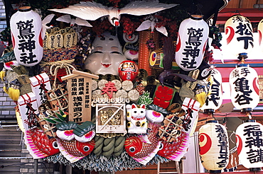 Decorative good luck rakes for sale at the Tori-no-Ichi Festival held annually in November at Otori Shrine, Tokyo, Honshu, Japan, Asia