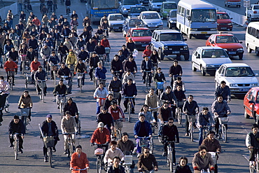 Street scene of bicycles and cars, Beijing, China, Asia