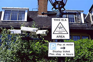 Neighbourhood Watch sign and security cameras, Kensington, London, England, United Kingdom, Europe