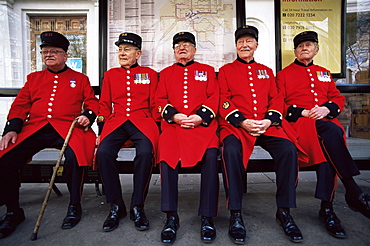 Chelsea Pensioners sitting at bus stop, London, England, United Kingdom, Europe