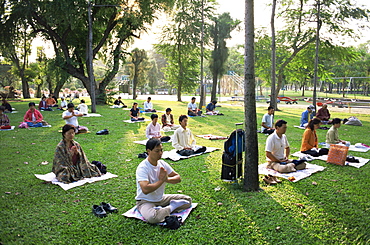 People meditating in Lumphini Park, Bangkok, Thailand, Southeast Asia, Asia