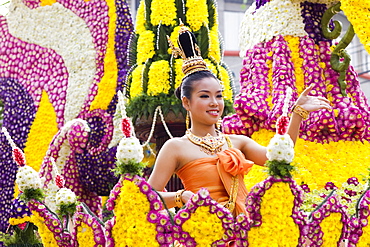 Girl on floral float at Chiang Mai Flower Festival Parade, Chiang Mai, Thailand, Southeast Asia, Asia