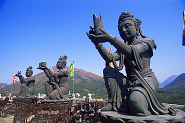 Chinese goddess statues at the base of the Giant Buddha Statue at Po Lin Monastery, Lantau, Hong Kong, China, Asia